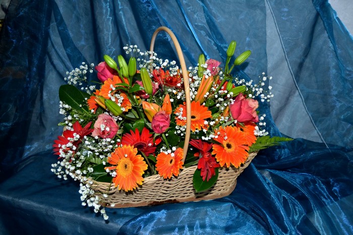 Flower basket with roses, lilies, and gerberas