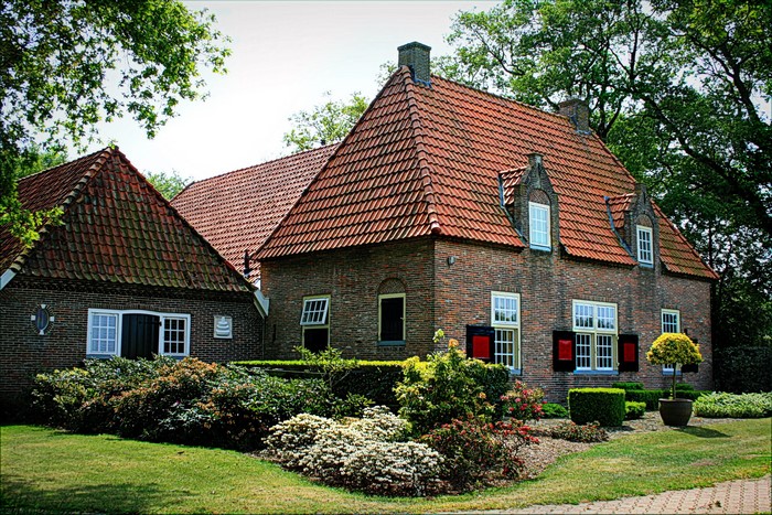 Brick houses with red tiled roofs in the Netherlands