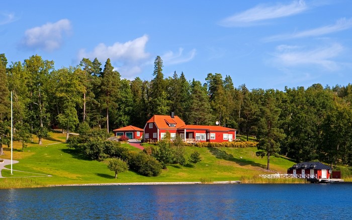 Red houses by a lake in Sweden