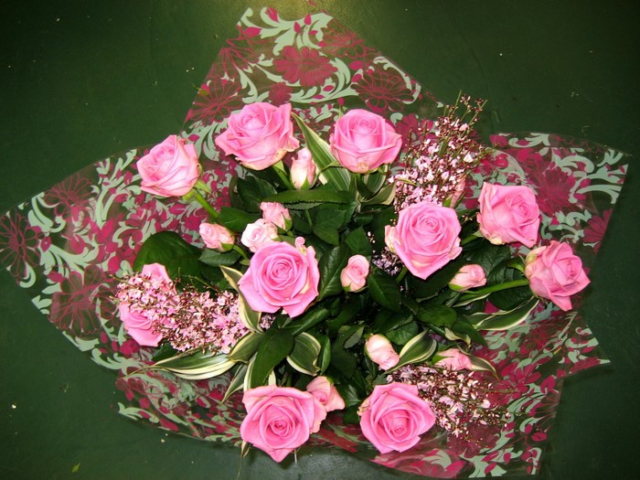 Pink roses in floral wrapping paper