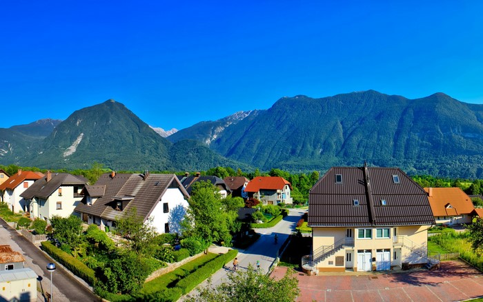 Houses in Bovec, Slovenia with mountains in background