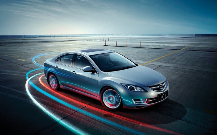 Silver Mazda 6 Sedan on Racetrack