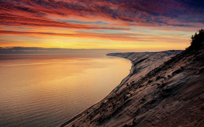 Sunset over a lake with sand dunes
