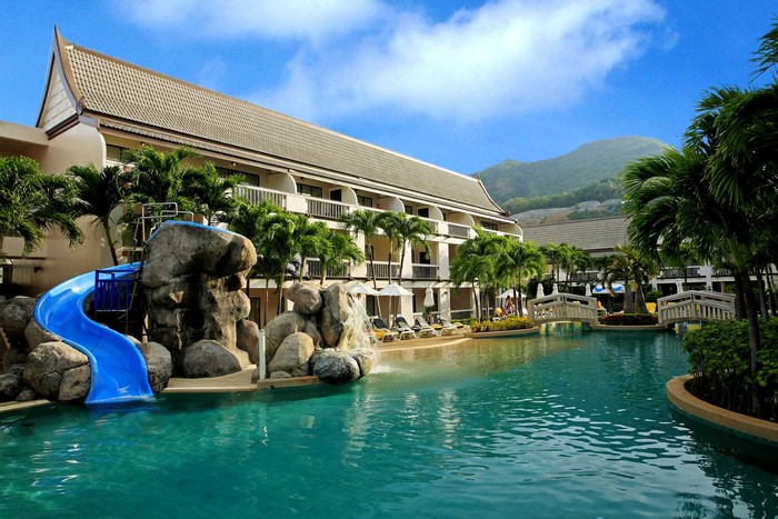 Resort pool with waterslide and bridges in Phuket, Thailand