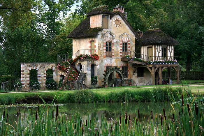 Rustic watermill house with thatched roof in France