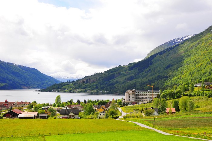 Village by a fjord in Norway with mountains
