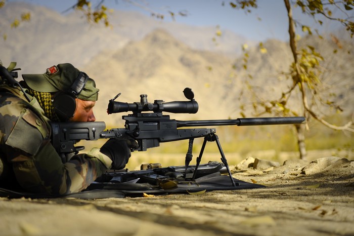 Soldier aiming a sniper rifle