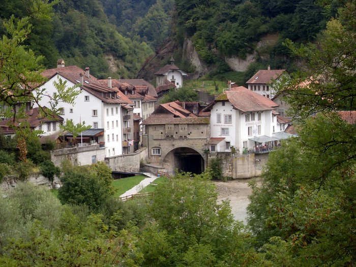 Town with bridge over river in Fribourg, Switzerland