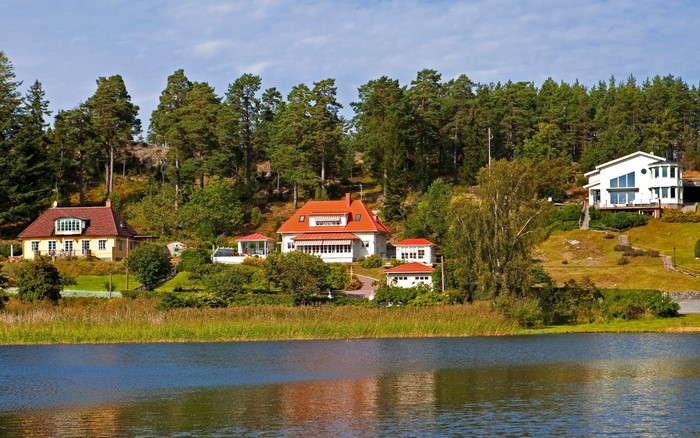 Houses on a hill overlooking a lake in Varmdo, Sweden