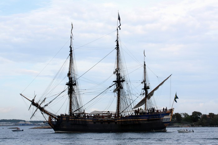 Tall ship with multiple masts sailing on the water