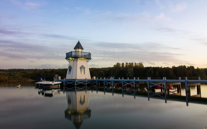Lighthouse on a pier at sunrise