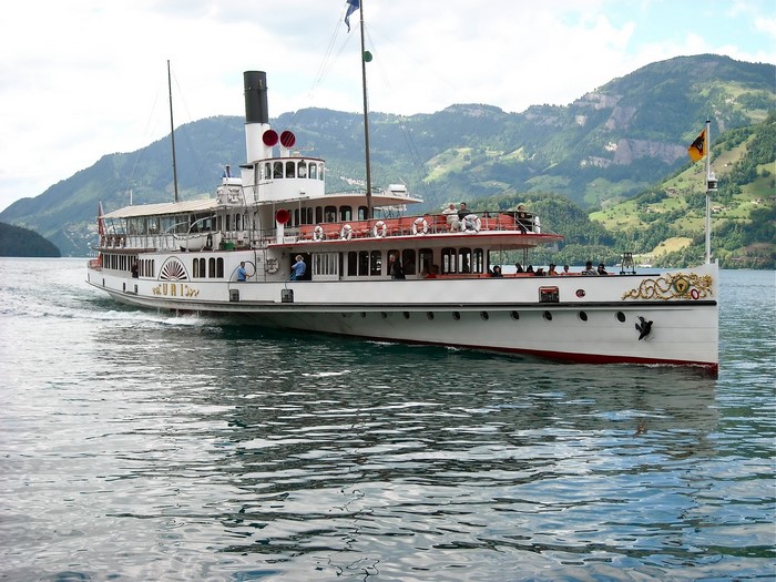 Steamboat URI on a lake with mountains