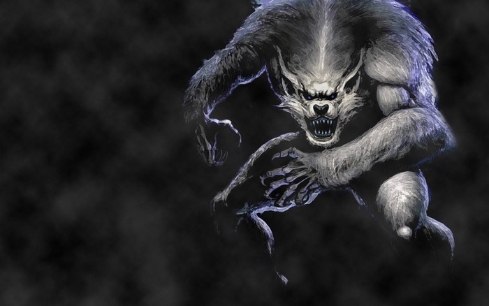 A menacing werewolf lunges forward in the dark