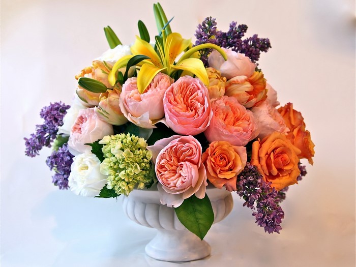 Floral arrangement in a white urn
