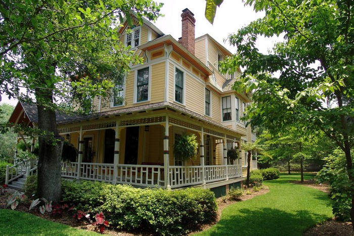 Yellow Victorian House with Wrap-around Porch in Gainesville, Florida