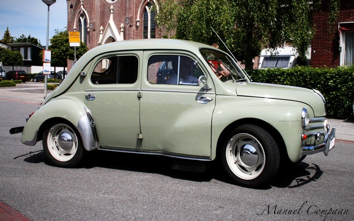 1956 Renault 4CV driving on a street