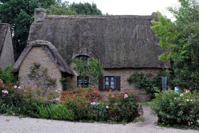 Thatched roof stone houses in Kerhinet village, France