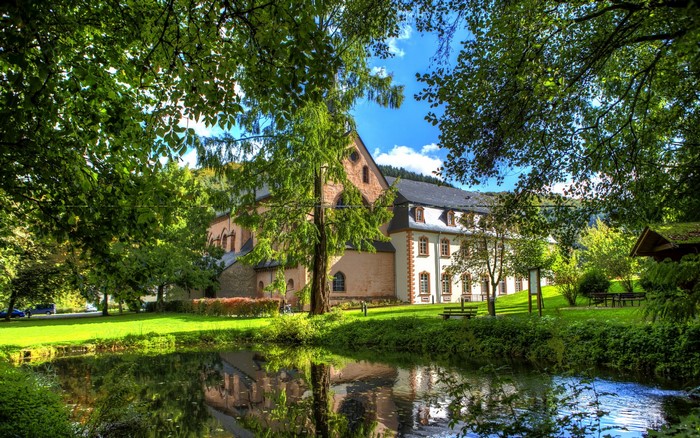 Monastery building by a pond in Germany