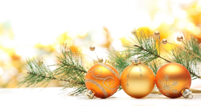 Christmas ornaments and pine branches with bokeh background