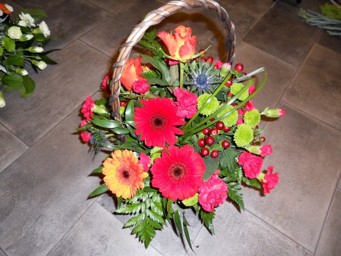 Flower basket arrangement with gerbera daisies and roses