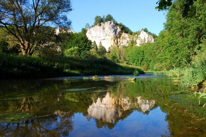 River reflecting cliffs and trees in Germany