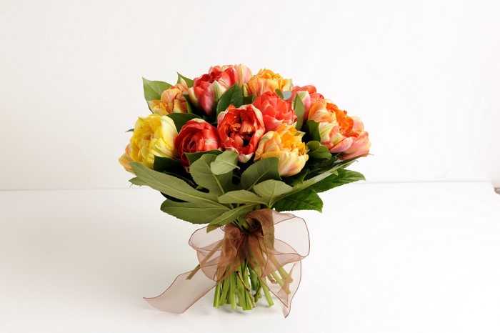 Bouquet of colorful tulips with a ribbon
