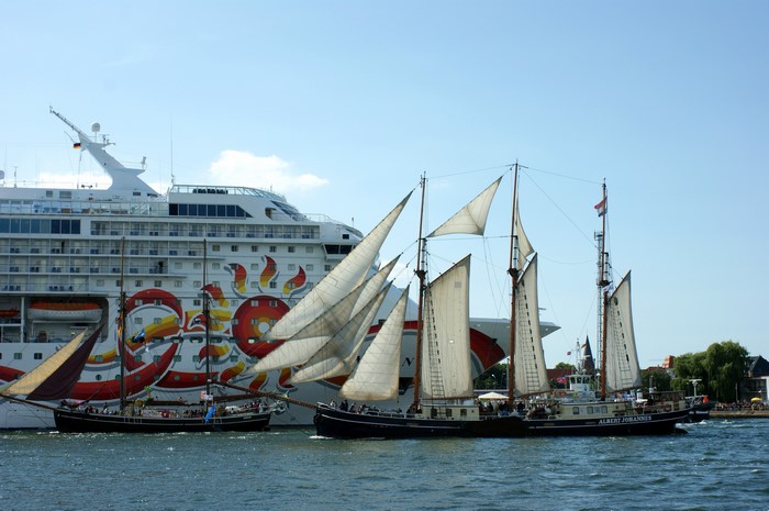 Cruise ship and sailing ships on the water