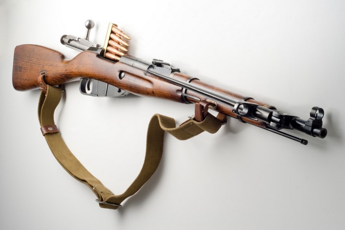 Bolt-action rifle with stripper clip and ammunition