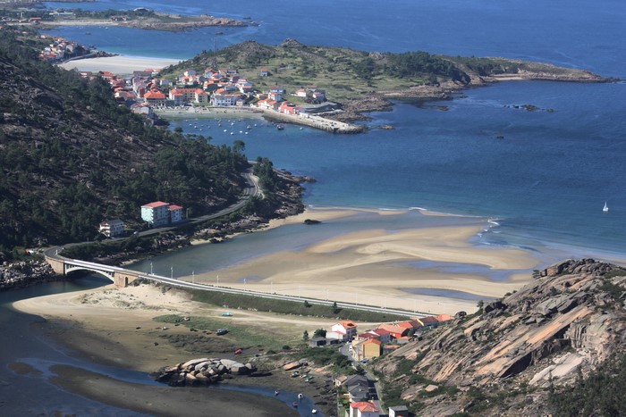 Coastal town with a bridge and beach in Spain