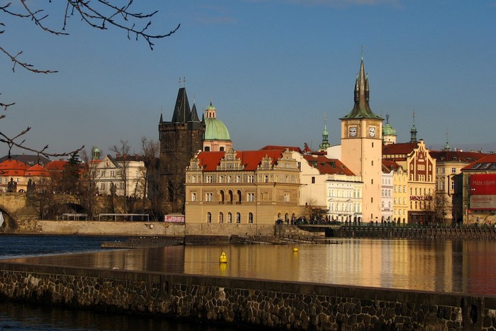 Prague cityscape with Charles Bridge towers and Vltava River