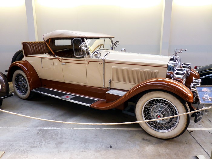 Two-tone brown and cream convertible classic car