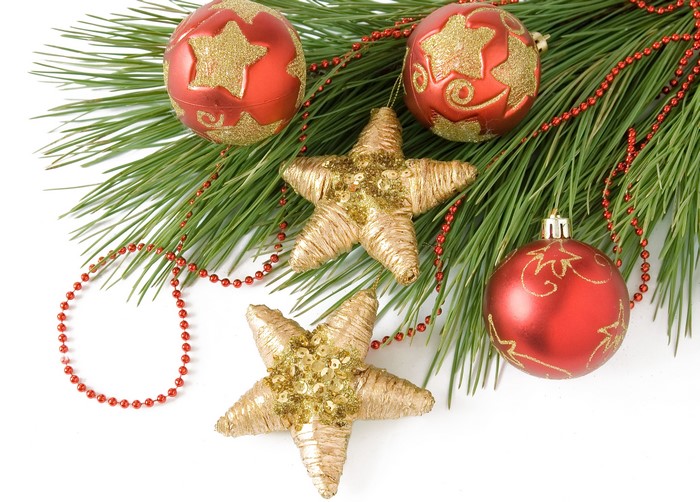 Christmas ornaments on pine branches with red beads