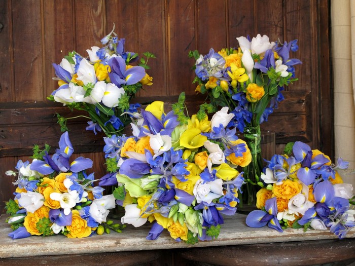 Bouquets of irises, roses, and calla lilies
