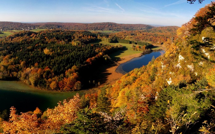 Autumn forest landscape with a lake in France