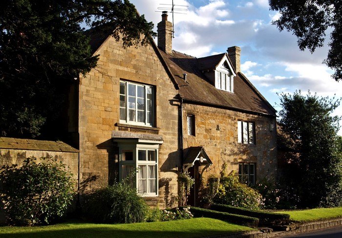 Stone house with bay window and garden in the UK