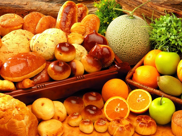 Assortment of baked goods and fruits