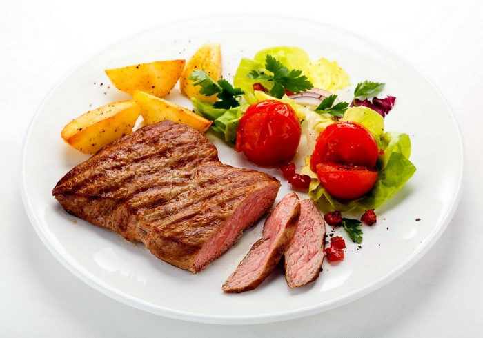 Grilled steak with roasted potatoes and salad