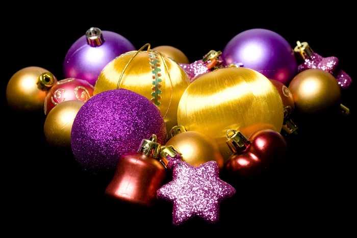 Christmas ornaments in purple, gold, and red