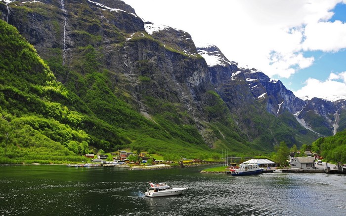 Boats on a Fjord in Norway with Mountains