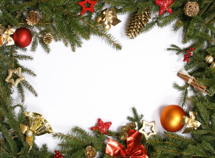 Christmas tree branches with ornaments and pine cones