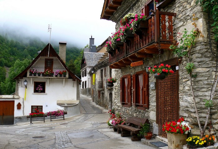 Stone village street with flowers in Spain