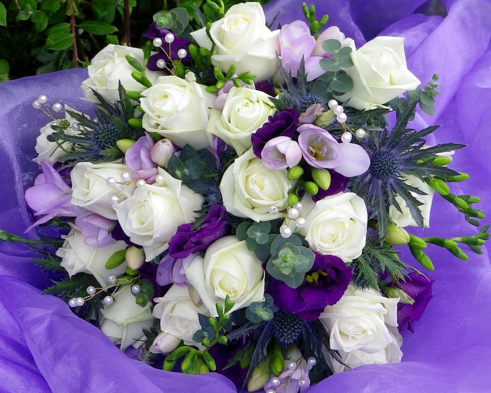 White roses and purple flowers bouquet