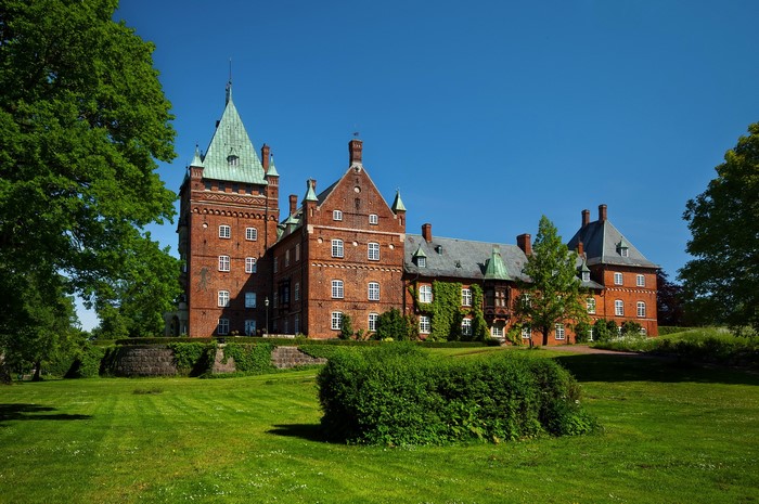 Trolleholm Castle in Sweden under a clear blue sky