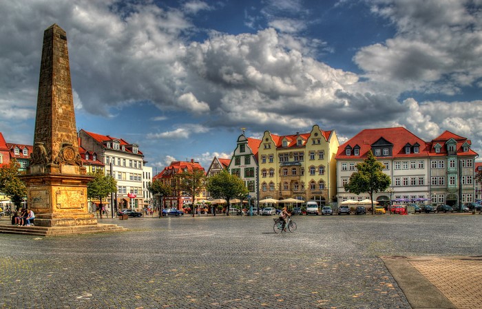 Obelisk in a European Town Square with Colorful Buildings
