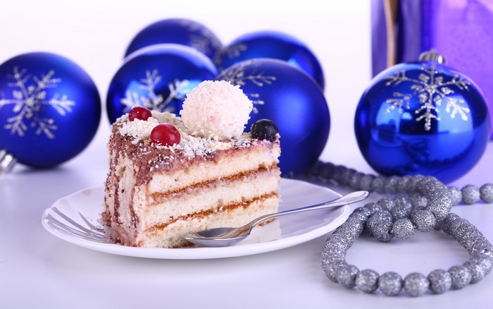 Slice of cake with Christmas ornaments