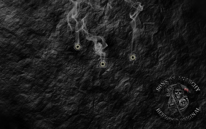 Sons of Anarchy logo with bullet holes and smoke