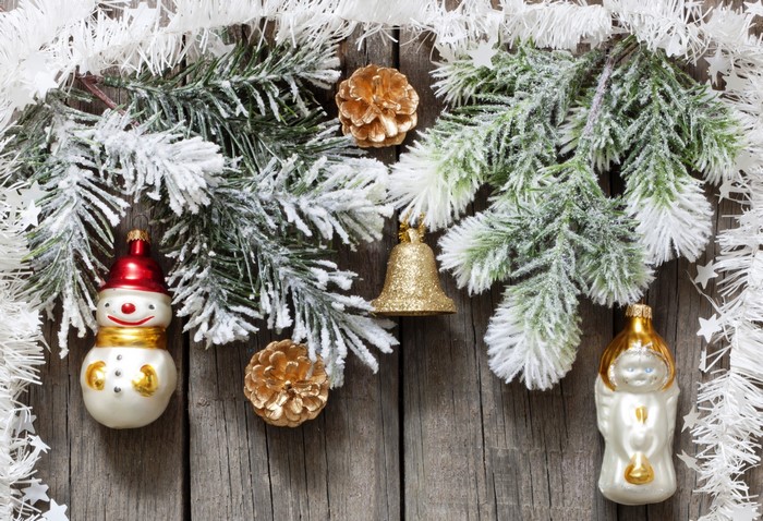 Christmas ornaments on frosted pine branches