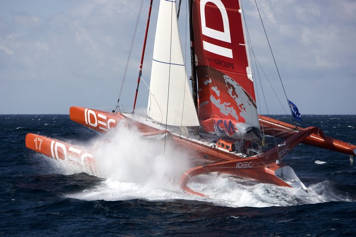 IDEC Groupe racing trimaran sailing on the ocean