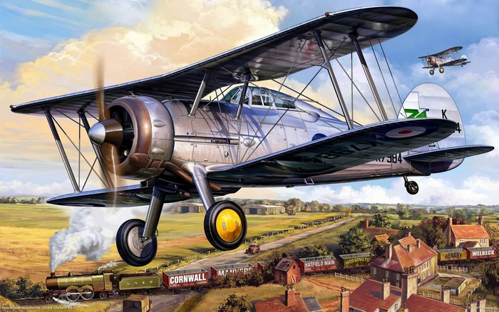 Gloster Gladiator Mk. I biplane flying over a train and village