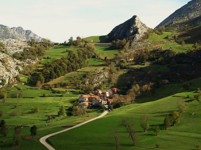 Village nestled in a green mountain valley in Spain